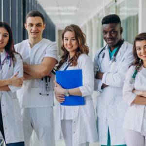 Nephrology USCE An image highlighting the Nephrology U.S. Clinical Experience (USCE) opportunities, showcasing a team of young specialist doctors standing in a hospital corridor.